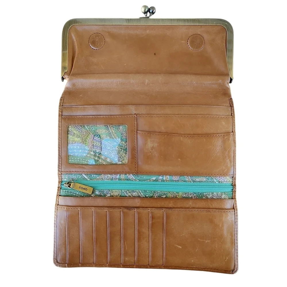 HOBO Distressed Tan Leather Clutch with Aqua Blue Paisley Lining And Kisslock